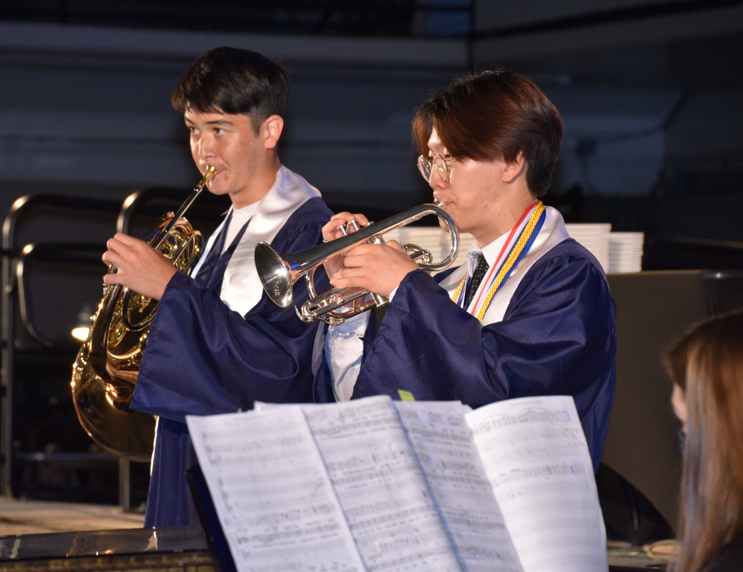 Olympia High School graduates (from left) Justin Baek and Hugh March perform music during the commencement ceremony