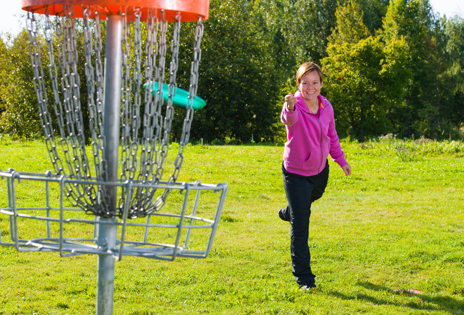 This woman is playing disc golf on one of the "more than 9,800" courses worldwide, according to The Professional Disc Golf Association.