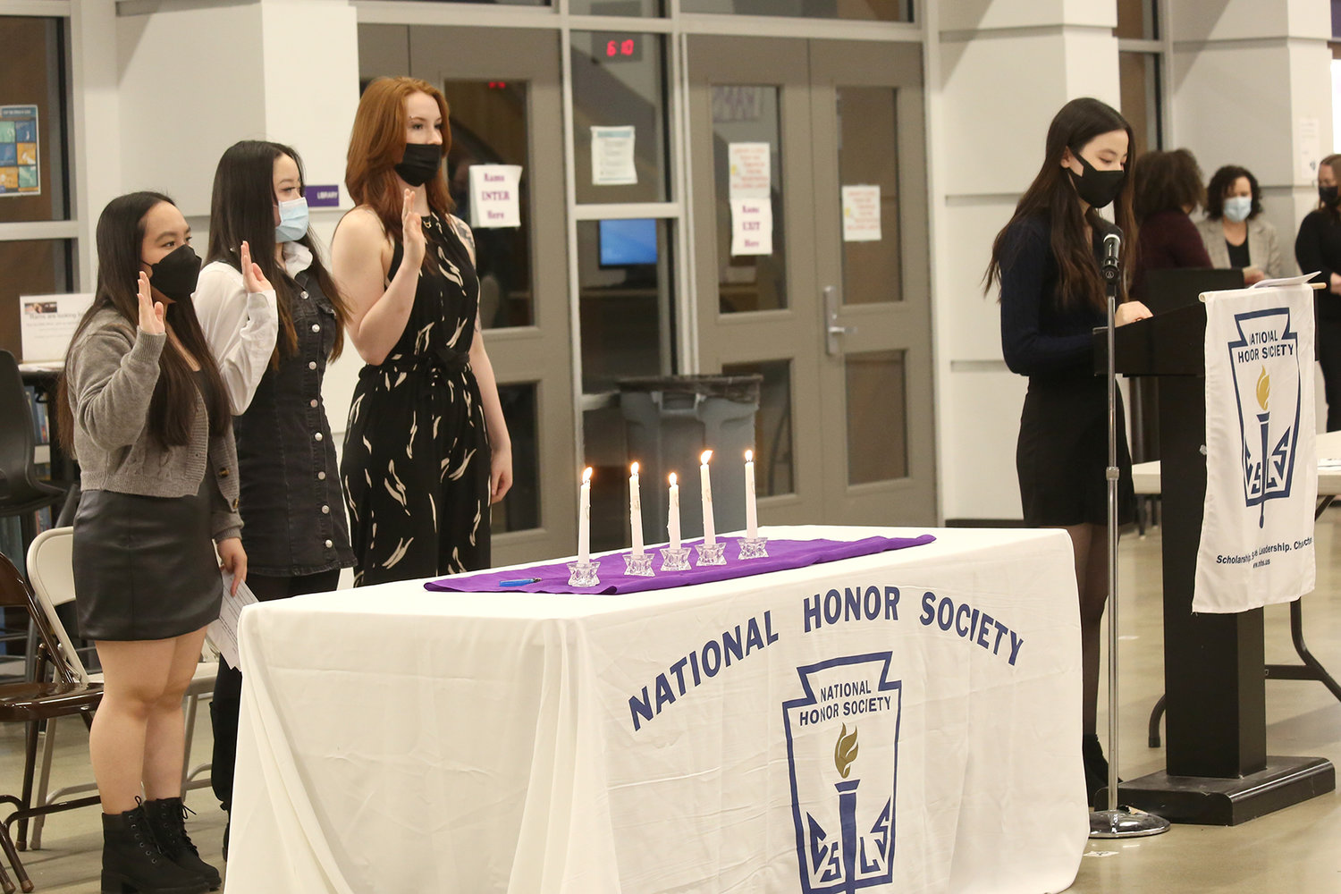 Honor Society officers lead the inductees during their pledge.