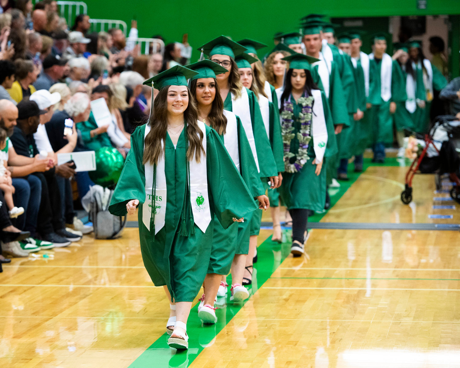 Tumwater High School 2022 graduates marching for their diplomas.