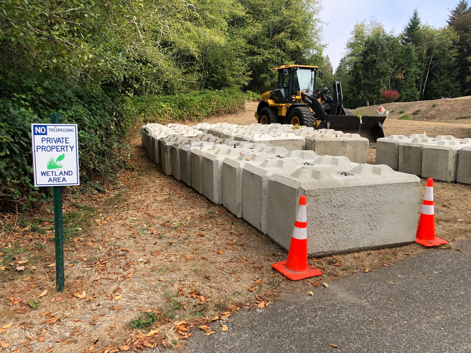 These "ecological blocks" are staged on Ensign Road, across the street from the remaining homeless encampment there, in this photo taken on October 3, 2022.
