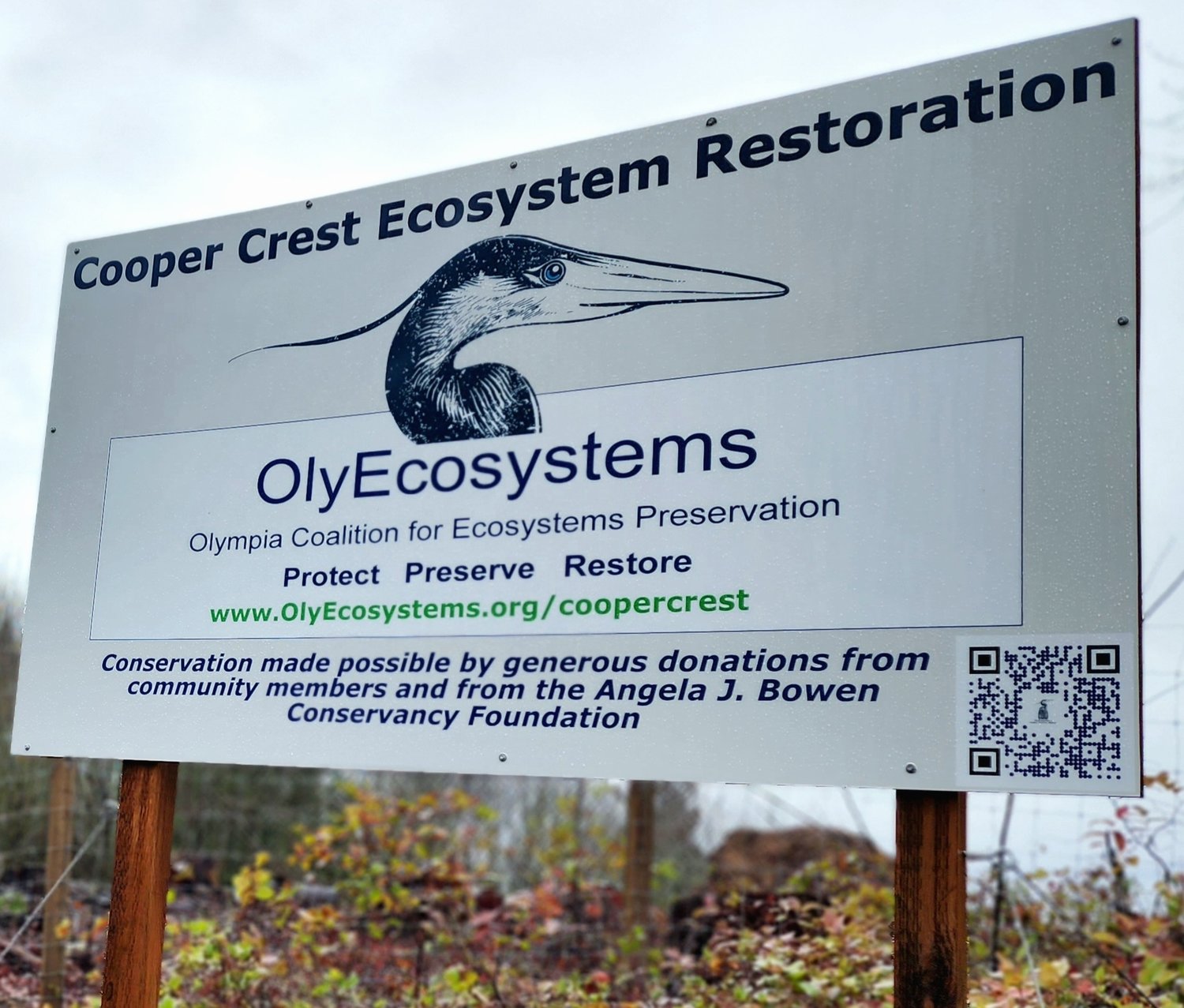 OlyEcosystems sign at the entrance to Cooper Crest.