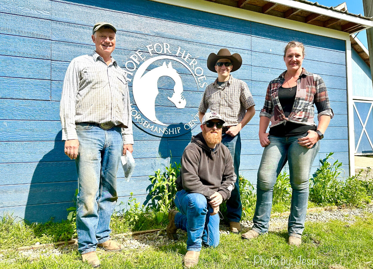Left to right: Robert Woelk, Aaron Combs, Joshua Dietz, and Caitlin Salvestrin. Combs (whose horse is Cutter) and Dietz (whose horse is Daivi) are students of the program and also volunteer extensively. (Combs actually owns Cutter.) They say Hope for Heroes is such a friendly and comfortable place that it is like a second home to many program participants, May 24, 2023.